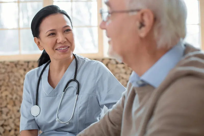 The Oaks of Garden Ridge | Senior and nurse having a friendly talk