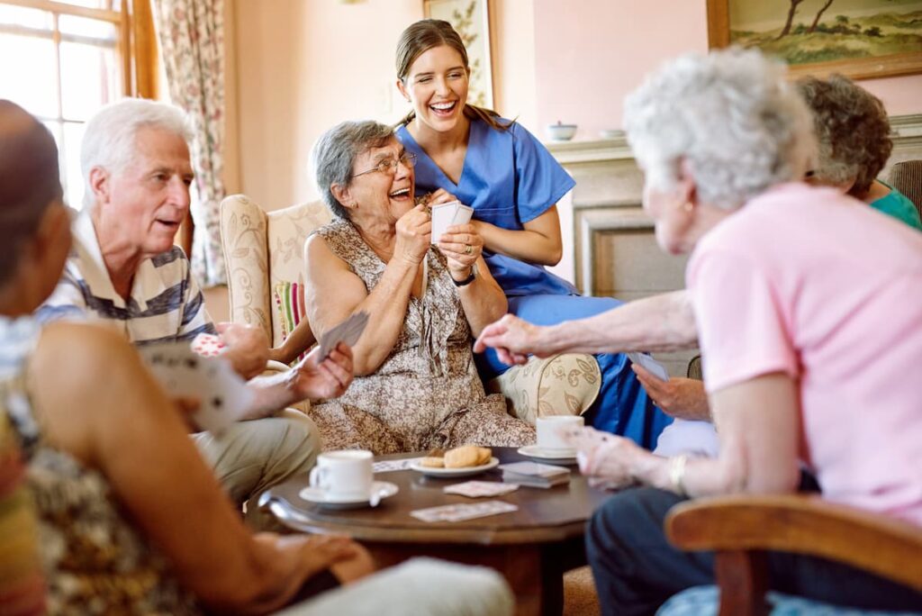 The Oaks of Garden Ridge | Senior friends laughing and playing cards
